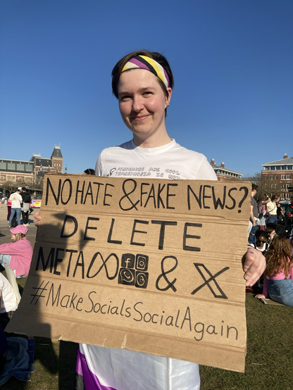 Another photo of me holding the sign.