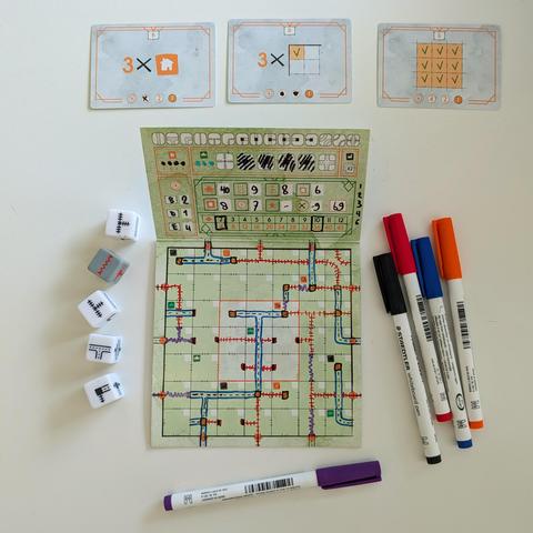 Top down photo of finished board with connected roads and railways.