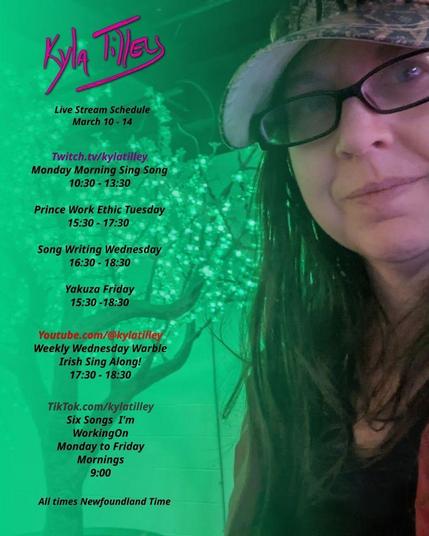 Kyla Tilley (White woman, dark red rectangle glasses, snake print ball cap) standing in front of a fake tree whose leaves are made up of little green lights.  She want's you to know that her live stream schedule for March 10 - 14th is as follows

Twitch.tv/kylatilley
Monday Morning Sing Song 10:30 - 13:30
Prince Work Ethic Tuesday 16:00 - 18:00
Song Writing Wednesday 16:30 -18:30
Yakuza Friday 15:30 -18:30

Youtube.com/@kylatilley
Weekly Wednesday Warble: Irish Sing Along 15:30 - 16:30

TikTok.com/@kylatilley
Six Songs I'm Working On
Monday to Friday Mornings 9:00

All times posted in Newfoundland Time
