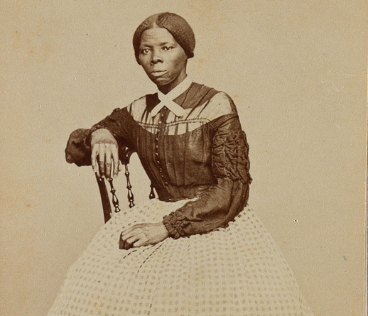 A younger Tubman, seated