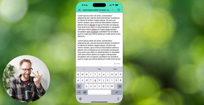 Das Bild zeigt ein Smartphone mit einer geöffneten Textbearbeitungs-App, in der der Lorem-ipsum-Text angezeigt wird. Darunter ist eine Tastatur eingeblendet, die sowohl Buchstaben als auch Sonderzeichen enthält. Im Vordergrund ist ein Mikrofon vor einer Person zu sehen, die eine Geste mit der Hand macht.