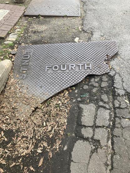 About 2/3 of a large rectangular metal plate inscribed with the words “Chestnut” and “Fourth”