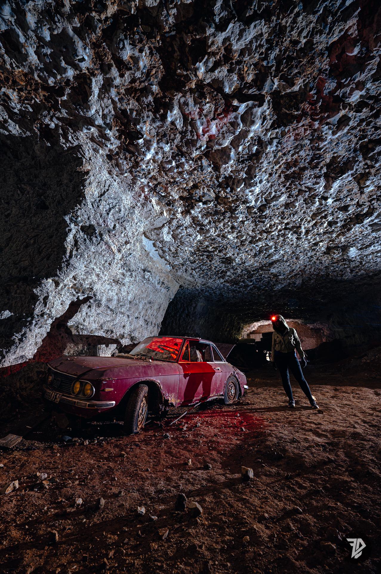 Abandoned car, Lancia Fulvia, inside an underground quarry Abandoned car, Lancia Fulvia, inside an underground quarry