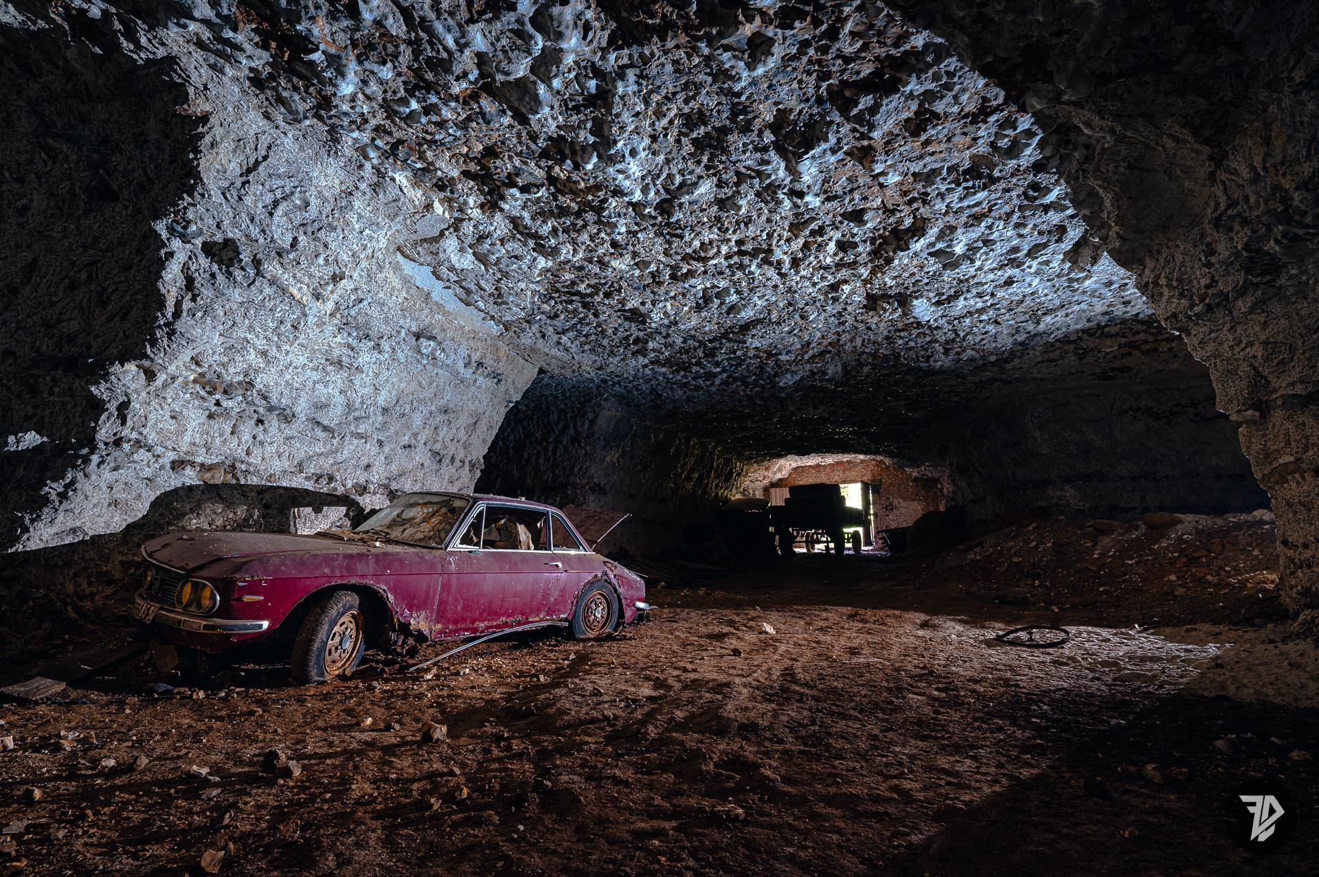 abandoned car, Lancia Fulvia, in an underground quarry abandoned car, Lancia Fulvia, in an underground quarry