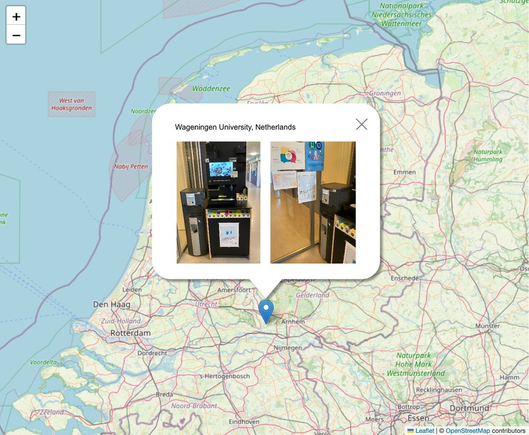 A map of the Netherlands (and surroundings) with a pop-up of the location "Wageningen University, Netherlands" and images of Save The AI posters displayed near water fountains.