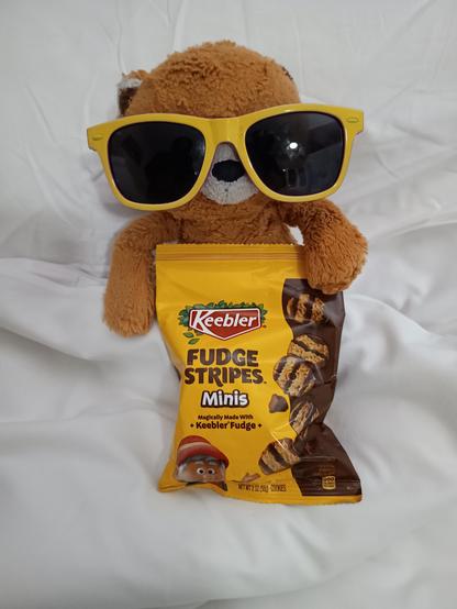 A jellycat eating Keebler biscuits