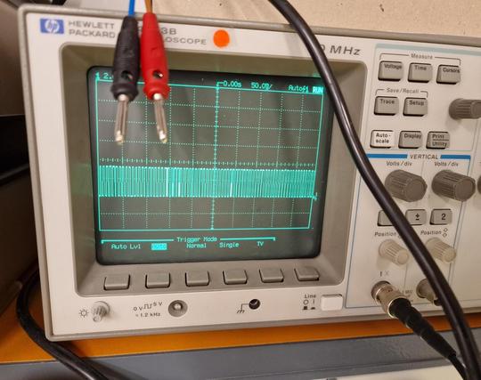Oscilloscope displaying a quite uniform high frequency wave