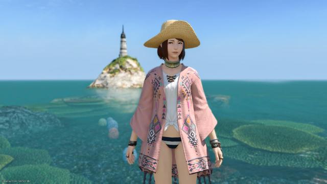 Panoramic view of the ocean and the light house with Esi posing in front of it all, smiling.