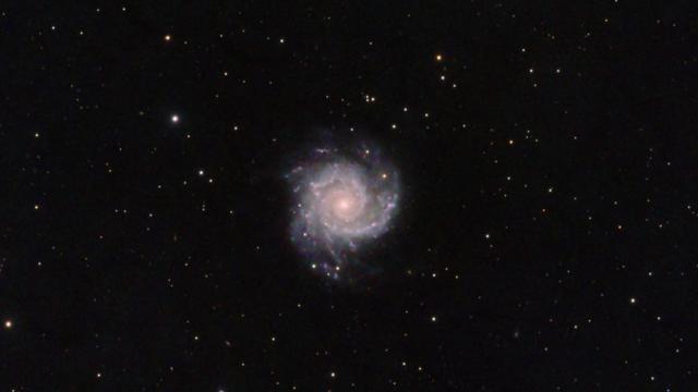 Messier 74 Phantom Galaxy
Black background with some stars of varying brightness and colour spread throughout. At center is a small spiral galaxy with an orange-ish core.