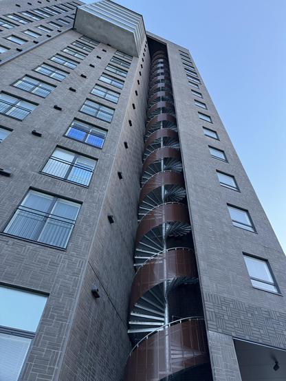 A building in Oulu with an interesting spiral staircase. It’s external to the building but kind of tucked in to a niche so it’s protected from the elements to some extent. 
