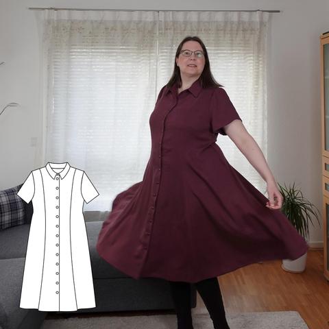 A woman twirling in a red princessline dress with collar and short sleeves.