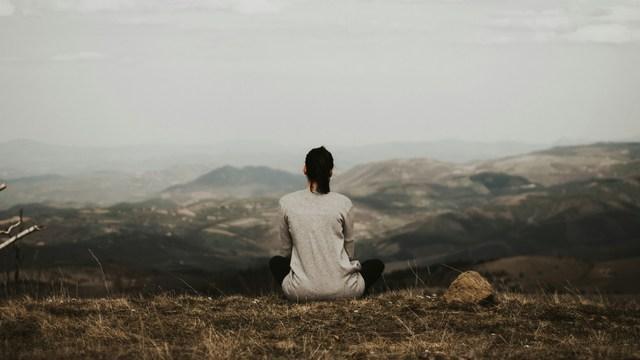 Person meditating.