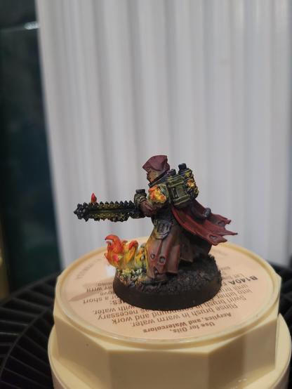 Back left of priest with flamethrower