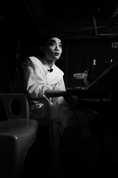 Chinese opera actor waiting behind the scenes for his time to go back to stage.