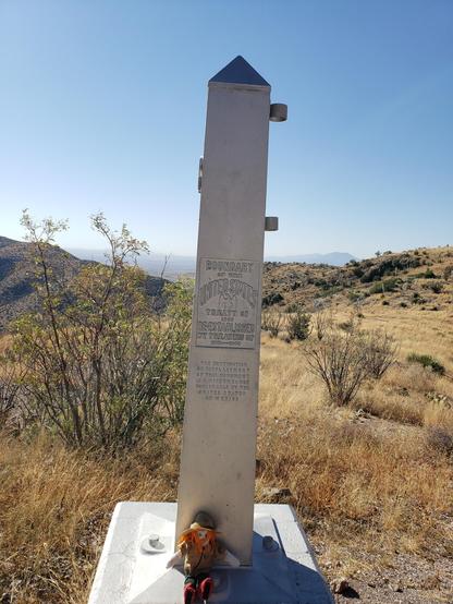 Ranger Sarah sits at the border on the US side at the border monument
— at Coronado National Memorial.
