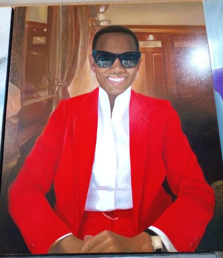 a painting of a woman sitting in an office, she has short black hair and is wearing sunglasses and a bright red blazer and pants with a white dress shirt, she is smliing, facing the viewer, seated, seen from her hips up 