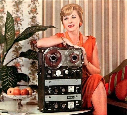 Marilyn King, a member of the King Sisters, poses with a vintage Roberts reel-to-reel tape recorder.