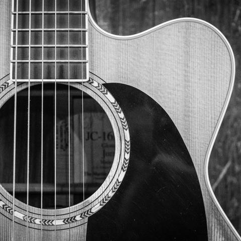Black and white acoustic guitar recording session at Core zero Studio