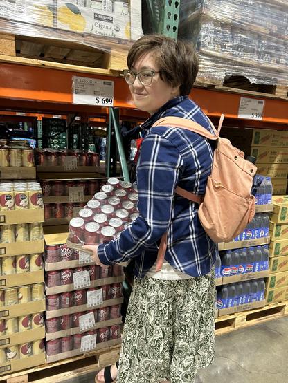 My eldest, in Costco Taiwan, grabbing a case of Dr. Pepper with a look of self-satisfaction on their face.