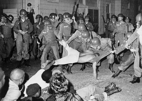 Black-and-white photo of SNCC photographer Clifford Vaughs forcibly being arrested by the National Guard in Cambridge, MD, 1964. Photo by Danny Lyon, who was born this day in 1942.