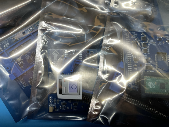 Photo of three unbuilt BlueSCSI kits still in their ESD bags