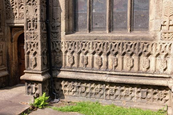 The granite exterior of a church profusely decorated with carvings.