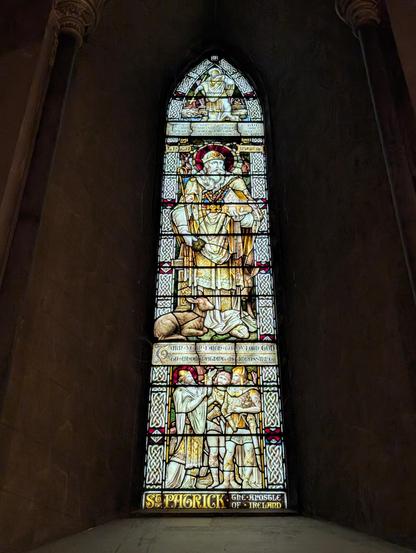 A stained glass window in St. Patrick's Cathedral in Dublin Ireland, depicting St. Patrick.