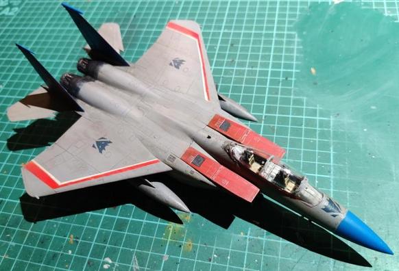 A high-angle front-right view of the F-15 model, the satin varnish makes the model look a bit shinier than an actual plane so that has to be knocked down a notch. The model is set on a well-worn green cutting mat.