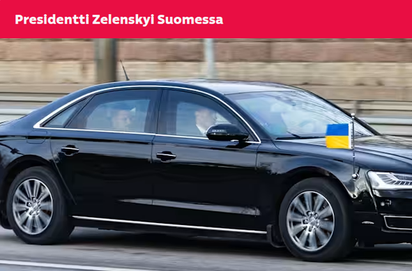 Zelensky sitting in the back seat of a black car with a Ukrainian flag, in the front you can see the driver and the security detail.
Käpylä, Helsinki 2025-03-18
(Image: Esa Syväkuru)
