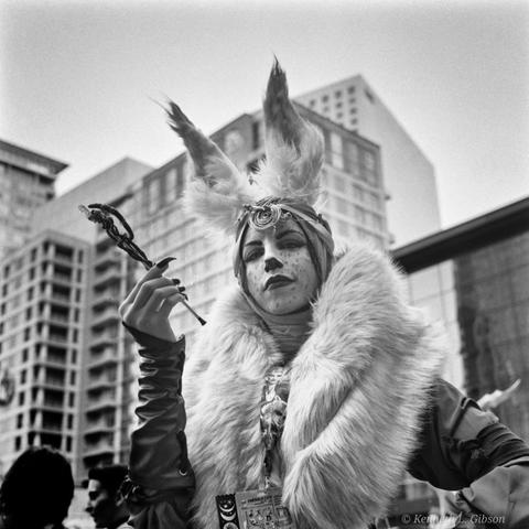 Woman cosplaying a character.  Yashica Mat 124 G.  Ilford HP5+ pushed to 800 iso. Developed in Rodinal 1+50.
