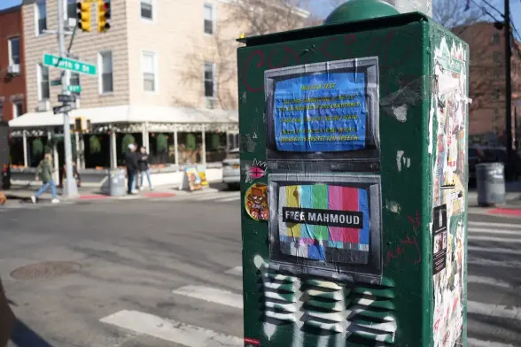 Text:
Free Mahmoud 
Image: 
“Tv 📺 Screen” 
Pasted on the street.