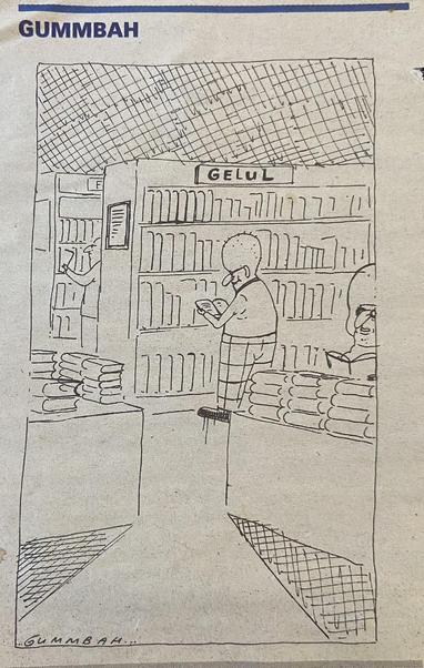 cartoon van Gummbah

Boekenwinkel, met links en rechts een tafel waarop stapels boeken liggen. Bij de tafel rechts staat een vrouw die wat door een boek bladert.
Op de achtergrond staan, ietwat schuin achter elkaar, een aantal boekenkasten, met een tekstbordje op de bovenrand van de kast om het genre aan te geven.
Bij de tweede kast is alleen de 1e letter van het genre te lezen: "F" (ik vermoed 'filosofie') De klant die voor die kast staat zet net een boek terug in het schap.
Bij de voorste kast staat een man in een boek te lezen, met een grijns.
Het genrebordje op die kast: "Gelul"  