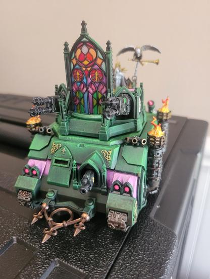 A green Immolator with pink accents