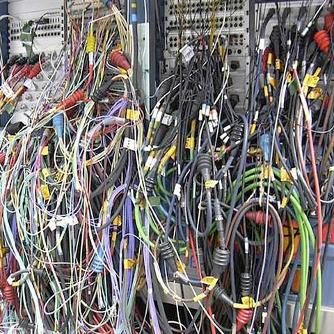 rat's nest of cabling and wire in a recording studio