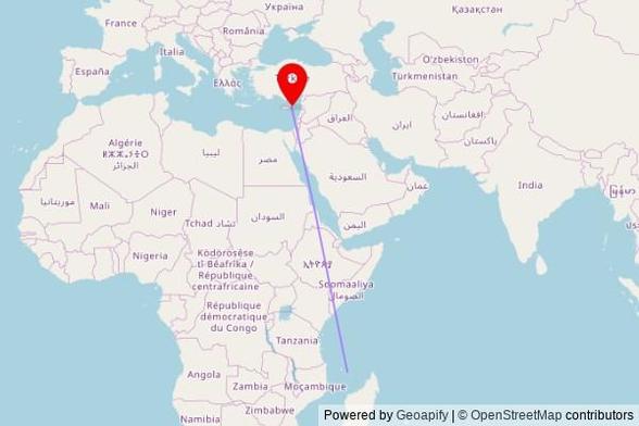 A map showing the great circle route from Comoni in Comoros to a map pin at Agioi Saranta, Ayiou Pantelimonos, 5297 Protaras, Cyprus