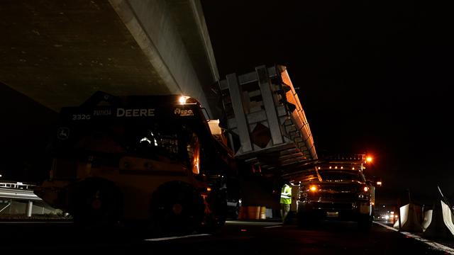 Delta intelligent crash cushion being unloaded from a truck in a late night installation Orange County, CA