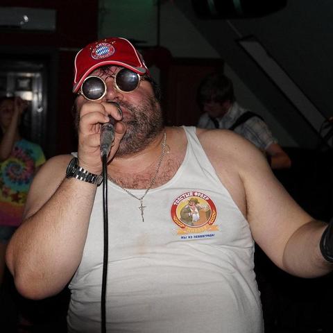 that guy with a microphone singing at karaoke