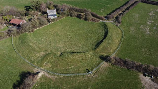 Oblique drone view of a massive defended enclosure in circular form with an internal diameter of around 52m.