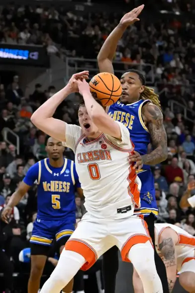 Clemson Stunned by McNeese State in NCAA Tournament First-Round Upset
By James Seidel | CC News Network Sports

PROVIDENCE, R.I. — Fifth-seeded Clemson University suffered a stunning early exit from the NCAA Men’s Basketball Tournament on Thursday, falling 69-67 to No. 12 seed McNeese State at Amica Mutual Pavilion in Providence.

The Cowboys (28-6) advance to face No. 4 Purdue in the second round on Saturday. Meanwhile, Clemson’s season ends at 27-7, after entering the tournament with high expectations.

Clemson endured a disastrous first half, managing just 13 points—its lowest scoring half of the season. The Tigers shot 5-for-24 from the field, including 1-for-15 from three-point range, and committed 10 turnovers, leading to a 31-13 halftime deficit.