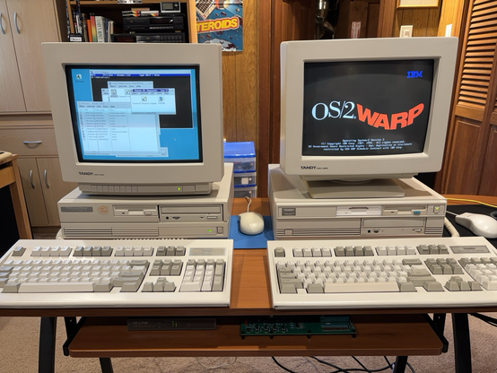 Two computers demonstrating remote boot of OS/2, with the client showing the OS/2 boot splash.