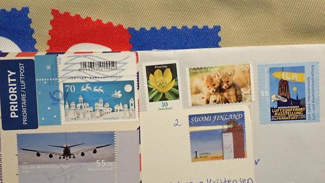 Stamps on postcards that hasn't been cancelled.