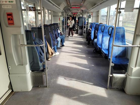 One row of seats in each direction, lots of standing space in the middle.
