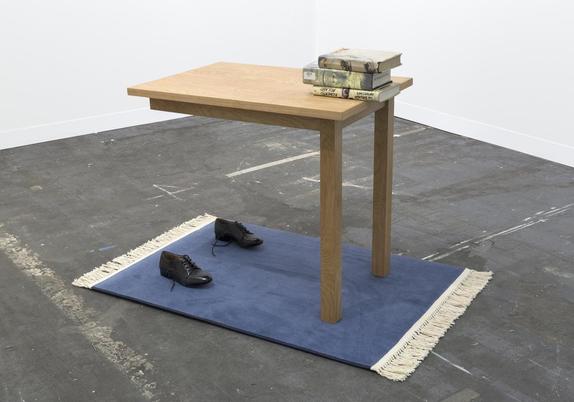 Two Leg Table by Jamie Isenstein, 2016 (shoes, rug, table, books, supports) 