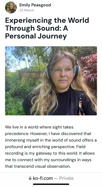 This is an image of Emily Peasgood in a woodland. She is wearing headphones and looking at the camera. 