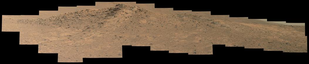 An ochre toned mosaic of a Martian landscape, capturing a rock outcrop.