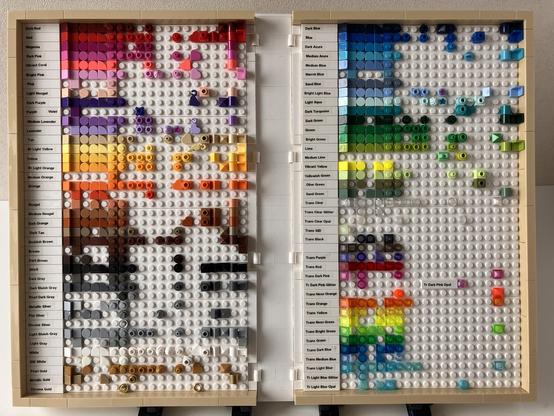 Colour chart showing many different 1x1 sized LEGO elements arranged in rows per colour, housed in a large folding book made of LEGO.  