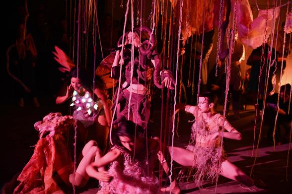 Me singing surrounded by creatures in pink