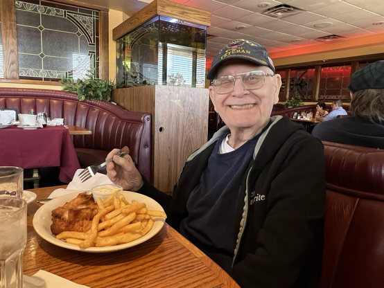 My father eating fish and chips at a restaurant. He’s a Navy veteran who served during the Vietnam War. 