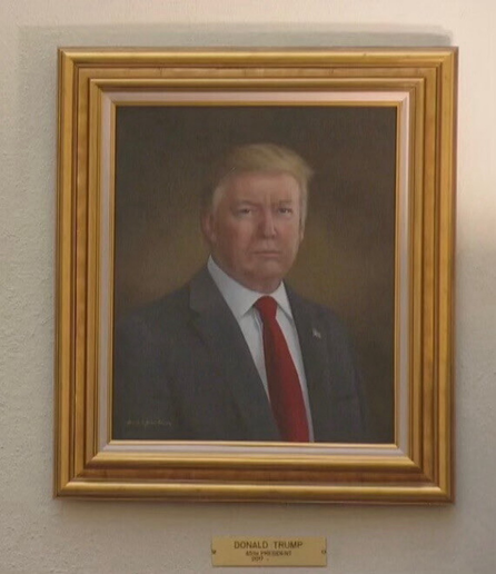 A portrait painting of Donald Trump. He isn't as orange as usual, and is a few pounds thinner, more caring and intelligent than in real life.