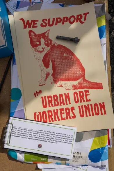 Poster text
WE SUPPORT 
The URBAN ORE WORKERS UNION 

Image a 🐱 cat 🐈‍⬛ 